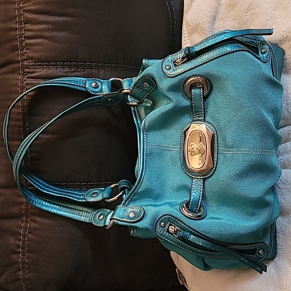 Teal colored Kathy Van Zeeland purse